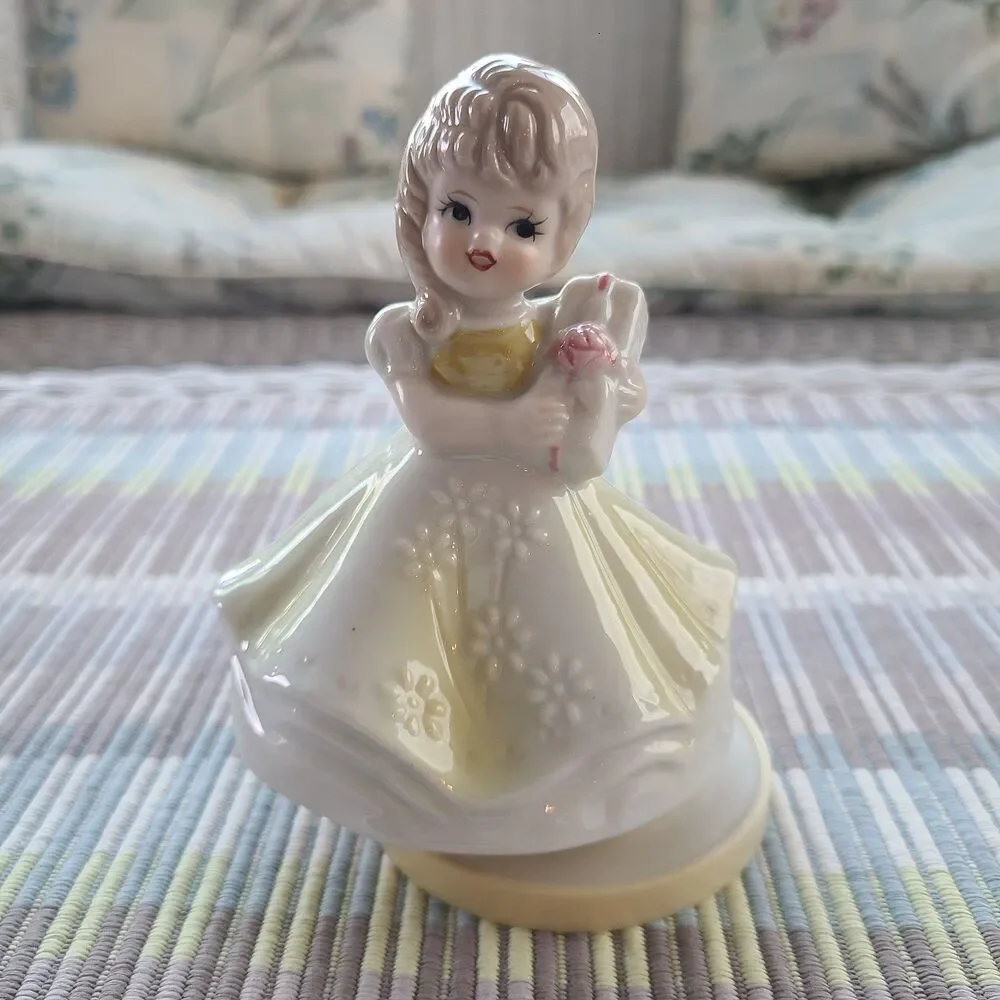 RARE Music Box Figurine With Lovely Young Girl Holding A Gift Plays Look Of Love